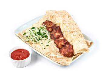 Skewers with sauce in a restaurant close-up