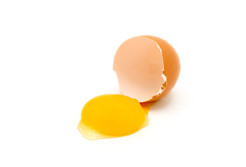 Broken egg yolk isolated on white background.