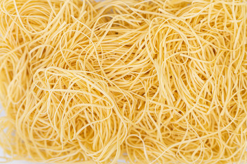 Dry homemade pasta for soup on the table