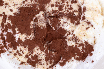 Cocoa powder on the sugar and whipped cream