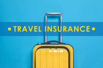 Yellow suitcase and phrase TRAVEL INSURANCE on blue background