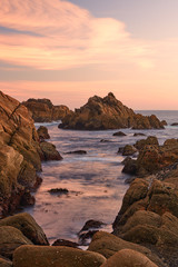 Fototapeta na wymiar Sunset between the rocks of the Galician coast.