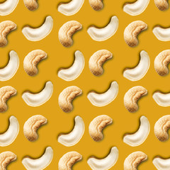 Seamless pattern of cashew nuts on a gold background. Food pattern of cashew nuts on a yellow background. Food pattern.