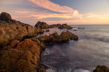 Sunset between the rocks of the Galician coast.