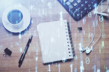 Double exposure of technology theme drawing over work table desktop. Top view. Global data analysis...
