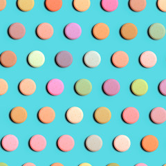 Seamless pattern of pharmaceutical pills or vitamins on a blue background. Multi-colored pills on a blue background.