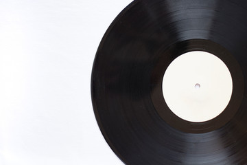 Close-up of part of a vinyl record isolated on white background.