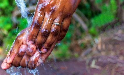 Washing hands with running water and soap. For hygiene and covid-19 prevention concepts.