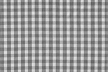 The texture of natural cotton fabric in a small regular cell of a light shade. Abstract checkered background. Plaid.