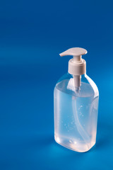 Alcohol Gel to prevention coronavirus. hand sanitizer soap. blue background