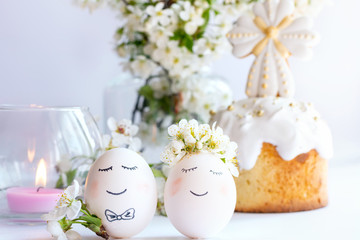 
Wedding couple eggs. Spring flowers on sweatshirt pastel background. A pair of eggs at a wedding ceremony.