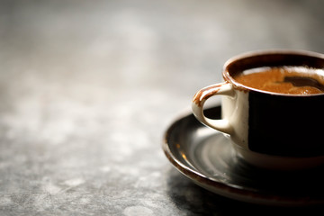 Detail view of coffee cup on the gray marble table