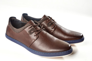 Men fashion brown shoe leather over white background. Pair casual stylish footwear.