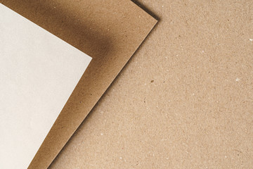 Brown recycled carton paper sheets close up. Business concept