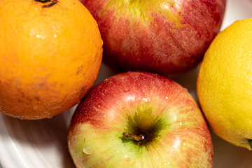 Apples with orange and lemon