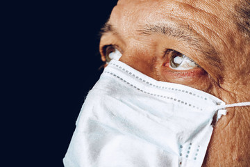 Portrait of a sick adult man in medical mask close up. Coronavirus pandemia concept