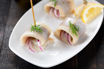 traditional herring rolls with onion and dill