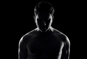 Fototapeta na wymiar Silhouette of a young man. Photo in black.