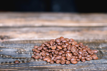 roasted coffee beans on a wooden table
