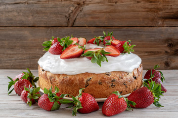 Easter cake with raisins with strawberries or Bolo rei is a christmas cake in Portugal.