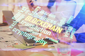 Double exposure of woman hands typing on computer and crypto market theme hologram drawing. Blockchain concept.