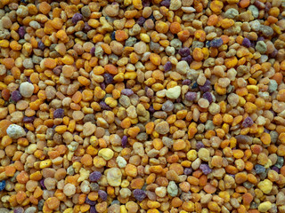 Bee pollen grains. Natural medicine to avoid influenza. Overhead shot.