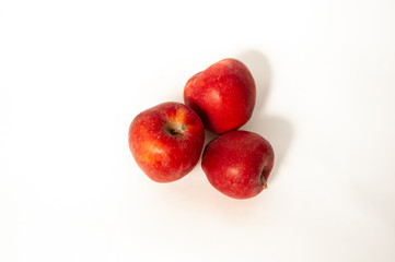 Red apples near a vase of lavender