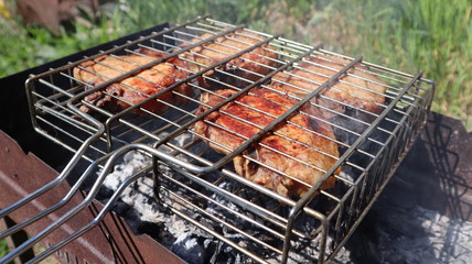 Pork steaks cooked on a charcoal grill outdoors