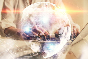 Double exposure of woman hands typing on computer and business theme hologram drawing. Success...