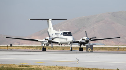 White Private Plane Taxi on Runway