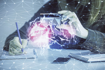 Double exposure of woman on-line shopping holding a credit card and brain hologram drawing. Data E-commerce concept.
