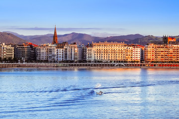 beautiful sunset view of sandy beach and center Donostia San Sebastian in the Bay of Biscay, Basque Country, Spain