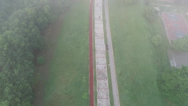 Novosadski kej. Early morning. Fog. Man jogging. Birds-eye view. Aerial footage