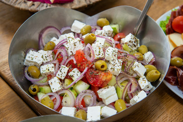 Greek salad in bowl close up