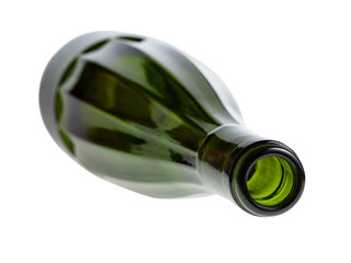 overturned faceted green wine bottle isolated