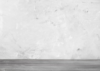 gray wooden flooring and gray concrete wall