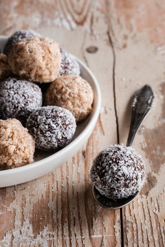Vegan protein balls with millet, coconut, cocoa and nuts