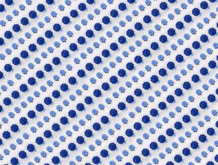 Aerial view of rows of blue beach umbrellas