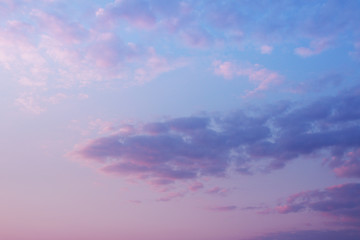 pastel pink blue evening sky with clouds