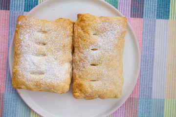 Delicious crispy bun with a plate on plate