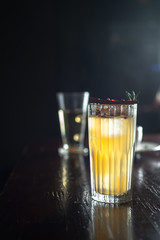 John Collins cocktail on the bar. Night club scenery.