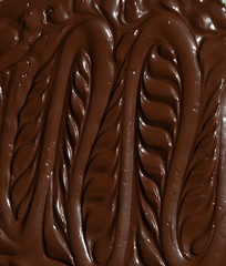 molten milk chocolate with wavy patterns