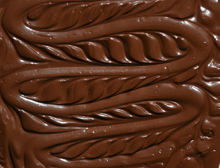 molten milk chocolate with wavy patterns
