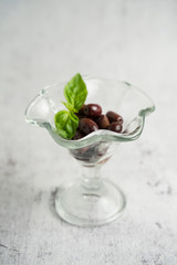 Maroon olives in a glass bowl