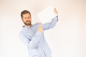handsome young man in blue shirt with paper