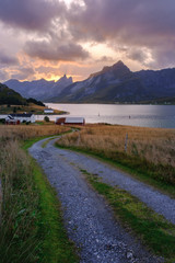 village road to home in norway among fjords and bay