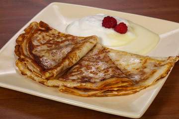 Pancakes with sour cream and condenced milk