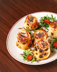 Pizza petals with Fior di latte, provolone, turkey ham, mushrooms, bresaola, truffle cream and seasonal fresh truffle. Italian cuisine. Wooden background