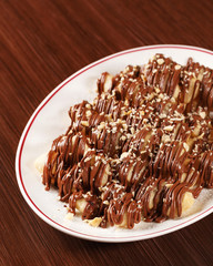 Nutelinne. Traditional Italian dessert with Nutella chocolate sauce and sweet dough. Coming with cappuccino. Tasty dessert