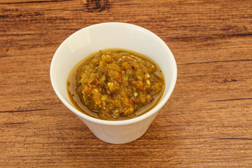 Green spicy sauce in the bowl